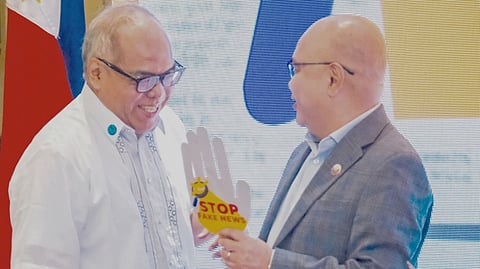 DAILY TRIBUNE executive editor Chito Lozada (left) and Presidential Communications Office Secretary Dave Gomez confer on a shared commitment to combat misinformation.