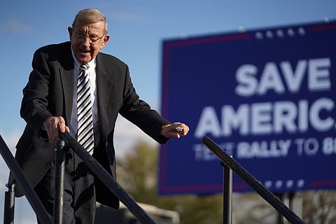 Lou Holtz leaves the stage during a rally with former U.S. President Donald Trump at the Florence Regional Airport on March 12, 2022 in Florence, South Carolina. The visit by Trump is his first rally in South Carolina since his election loss in 2020.