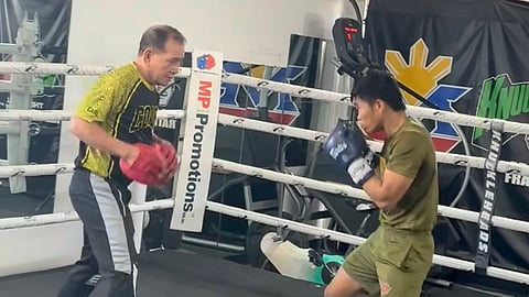 WORLD champion Pedro Taduran (right) and chief trainer Carl Peñalosa Jr. ramp up their training camp in Las Vegas.