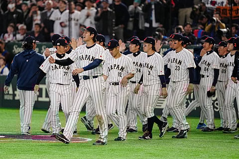 Japan's Shohei Ohtani (L) celebrates their victory after the World Baseball Classic (WBC) Pool C game between Japan and South Korea at the Tokyo Dome in Tokyo on March 7, 2026.
