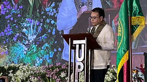 DHSUD Secretary Jose Ramon Aliling delivers his keynote address during the 117th Foundation Day celebration of the University of the Philippines Los Baños, where he urged Filipinos to uphold integrity and continue the fight against corruption.