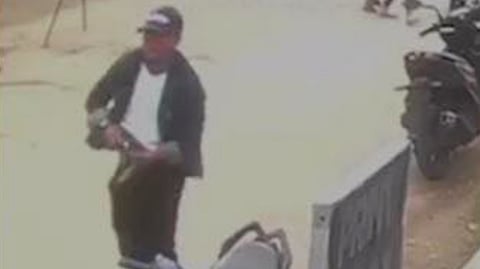 AUTHORITIES show the surveillance footage which identified the suspect escaping the vicinity immediately following the shooting.