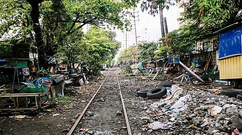 A THRIVING community stands along the abandoned train tracks in Tayuman, Manila, on 8 March. The Philippine National Railways suspended operations nearly two years ago to make way for a more modern railway system, but the project remains under construction, leaving the old tracks reclaimed by residents who have built their homes beside them.