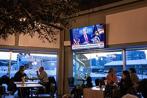 PEOPLE sit inside a cafe in Nuuk, as a television broadcasts US President Donald Trump amid ongoing reactions to his statements about Greenland’s future during heightened geopolitical tensions over the Arctic territory.