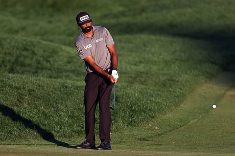 SAHITH Theegala of the United States chips onto the 18th green during the opening round of The Players Championship.
