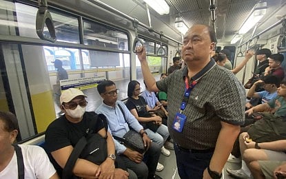 MRT-3 General Manager Michael Capati riding in one of the trains of MRT-3.