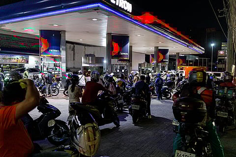 MOTORISTS in Quezon City queue at a gasoline station to fill their tanks. A second round of fuel price increase is expected to be imposed by petroleum companies on Tuesday, as conflict in the oil-rich Middle East persists.