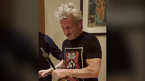 AMERICAN actor Sean Penn holds a symbolic version of the Oscars statuette in Kyiv.