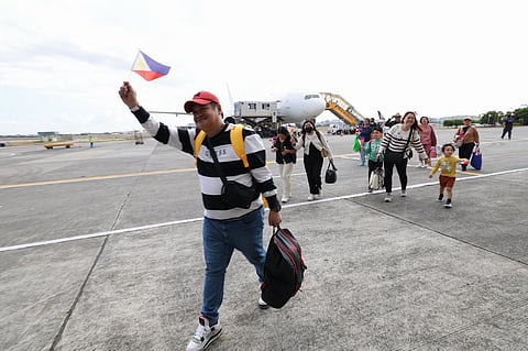 A total of 317 Filipinos who safely returned to the country aboard the third government-chartered flight on Thursday at the Villamor Airbase in Pasay City.