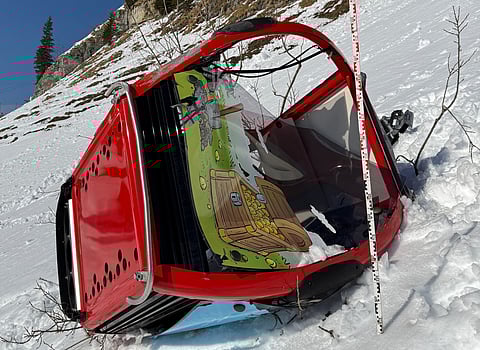 A GONDOLA lays on the snow after it detached and crashed, rolling several times in Titlis-Engelberg ski area in Engelberg, central Switzerland, as strong winds were reported in the area, on 18 March 2026.