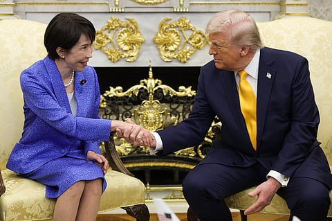 WASHINGTON, DC - MARCH 19: Prime Minister of Japan Sanae Takaichi (L) shakes hands with U.S. President Donald Trump during a bilateral meeting in the Oval Office of the White House on March 19, 2026 in Washington, DC. The two leaders are expected to discuss topics including the current conflict in Iran and the threat that is posed by China.