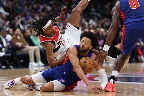CADE Cunningham of the Detroit Pistons dives for a loose ball that prompted him to suffer a collapsed lung in the first quarter of their 130-117 win over the Washington Wizards in the NBA regular season.