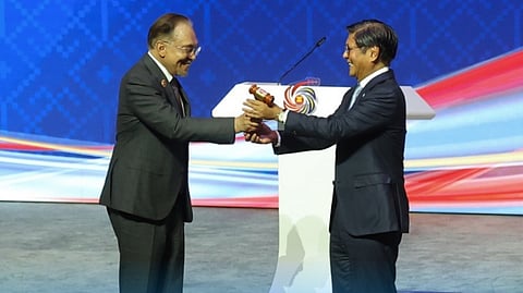 MALAYSIAN Prime Minister Anwar Ibrahim passes the ASEAN chairmanship gavel to President Ferdinand R. Marcos Jr. (right) at the closing ceremony of the 47th ASEAN Summit and Related Summits in Kuala Lumpur, Malaysia on 28 October 2025. The Philippines will host the 2026 ASEAN Summit in Manila on 10-12 November 2026.