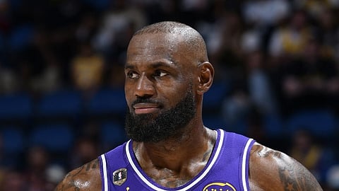 LeBron James #23 of the Los Angeles Lakers looks on as he plays a record 1,612th game of his career, breaking Hall of Famer Robert Parish for the all-time games-played mark on March 21, 2026 at Kia Center in Orlando, Florida.