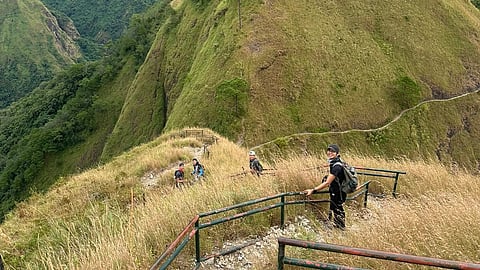 MMS members climbing a peak.