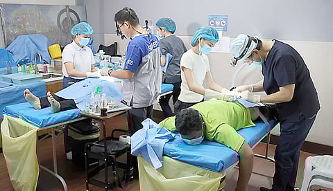 VOLUNTEER surgeons remove benign cysts from patients at the Tzu Chi Eye Center in Sta. Mesa, Manila on 15 March 2026.