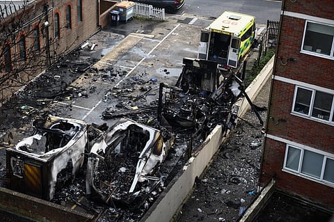 Burnt out ambulances are pictured in a parking area along a street in the Golders Green neighbourhood of north London on March 23, 2026, after the volunteer ambulances run by a Jewish organisation were set on fire overnight. Britain's Prime Minister Keir Starmer on March 23 condemned "a deeply shocking antisemitic arson attack" on volunteer ambulances run by a Jewish organisation in London.