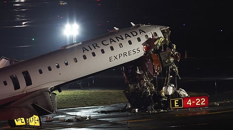 COLLISON on course An Air Canada Express CRJ-900 sits on the runway after colliding with a Port Authority fire truck at LaGuardia Airport in New York, on 23 March. Air Canada Express flight AC8646 originated from Montreal and hit the fire truck during landing.