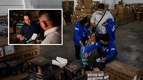 THE officials from the Bureau of Customs inspect the seized P1.4 billion worth of smuggled vape products at a warehouse in San Rafael Village, Navotas City on Monday.