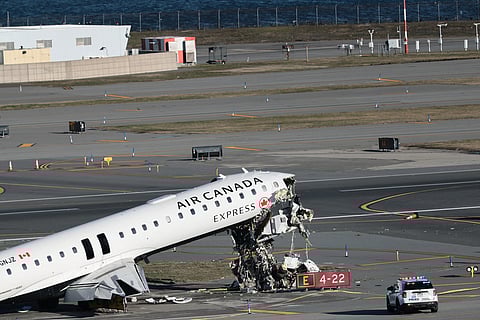 NEW YORK, NEW YORK - MARCH 24: An Air Canada Express CRJ-900 sits on the runway after colliding with a Port Authority fire truck at LaGuardia Airport on March 24, 2026 in New York City. Flights into and out of LaGuardia airport have resumed after an Air Canada Express plane flight from Montreal collided with a fire truck on the tarmac killing the pilot as well as the co-pilot and leaving more than forty people injured.