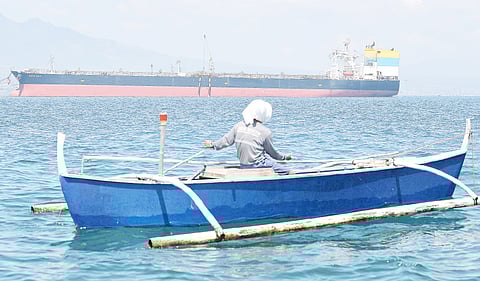 RUSSIAN oil to the rescue Not that the need is dire at this point according to President Ferdinand Marcos Jr., but Filipinos like this fisherman in his small dinghy going past the Sierra Leone-flagged Sara Sky may see the crude oil from Russia as a blessing. Seen anchored at Limay port, Bataan province on 26 March, the ship is carrying more than 700,000 barrels of Russian crude oil.