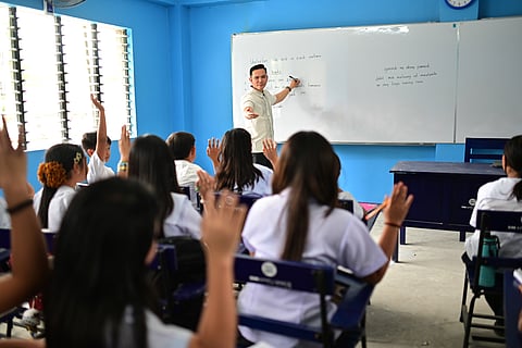 MAGTAKING Elementary School principal Christopher Macasias with students at the new school building donated by the SM Appliances Center through SM Foundation Inc.