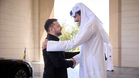 UKRAINE’s President Volodymyr Zelensky (left) and Qatar’s Emir Sheikh Tamim bin Hamad Al-Thani shake hands during their meeting in Doha.