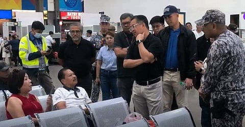 PPA general manager Atty. Jay Santiago converses with passengers in Batangas Port during his inspection on Monday.