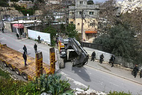 ISRAELI security forces patrol as Jerusalem municipality workers prepare to demolish a house belonging to a Palestinian family, which Israeli authorities say was built without a permit, in the Arab east Jerusalem neighborhood of Silwan. Israeli authorities regularly target what they describe as unauthorized construction in Jerusalem’s annexed east, a campaign that local Palestinian officials characterize as a ‘systematic policy’ to displace residents.