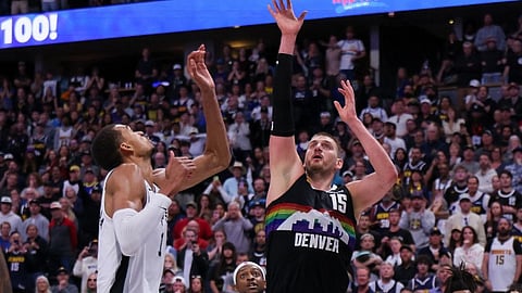 Nikola Jokic #15 of the Denver Nuggets scores against Victor Wembanyama #1 of the San Antonio Spurs in overtime at Ball Arena on April 4, 2026 in Denver, Colorado. NOTE TO USER: User expressly acknowledges and agrees that, by downloading and or using this photograph, User is consenting to the terms and conditions of the Getty Images License Agreement. The Nuggets won the game 136-134 in overtime.