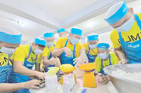 KNEADING a new beginning, PDLs prepare dough during their three-day intensive workshop, laying the groundwork for their sustainable livelihoods.