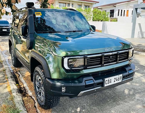 UP FRONT, the boxy shape and raised stance reflect a vehicle built for long drives and rough sections alike.