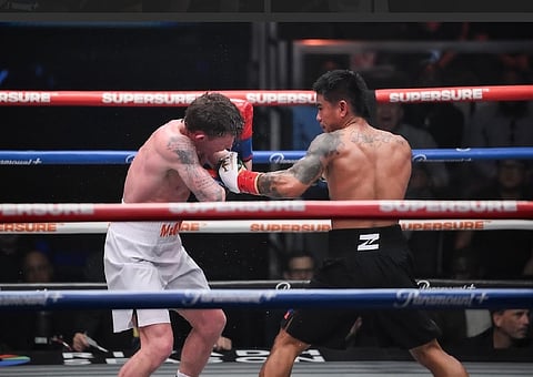 MARK ‘Magnifico’ Magsayo batters Irish Feargal McCrory en route to a fifth-round stoppage in their scheduled 10-round lightweight duel on Monday (Manila time) during ZUFFA Boxing’s show at the Meta APEX in Las Vegas.