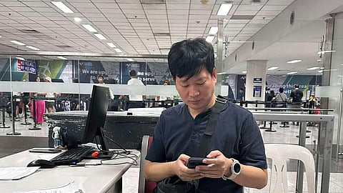 Kim Kwangsin, 43, a South Korean fugitive wanted for fraud was intercepted at the Ninoy Aquino International Airport Terminal 3. (Photo by BI)