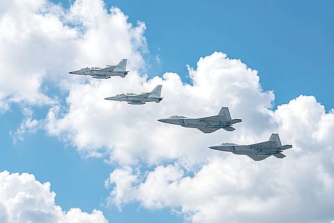 FA-50PH and F-22 Raptor aircrafts fly in formation as the military commence the Training Flight Exercise of the Cope Thunder 25-1 at the Basa Airbase in Floridablanca, Pampanga.