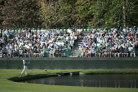 RORY McIlroy hits the ball on the 16th hole during a practice round prior to the 90th Masters Tournament at Augusta National Golf Club in Augusta, Georgia.