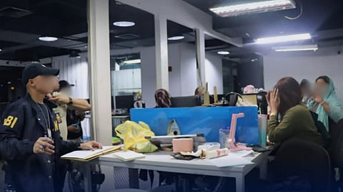 Operatives from the NBI Cybercrime Division and Special Action Unit dismantle a large-scale investment fraud ring during a raid in Makati City. The operation led to the arrest of 22 suspects at a Gil Puyat Avenue business plaza who allegedly used manipulated trading platforms and fabricated profits to deceive investors.