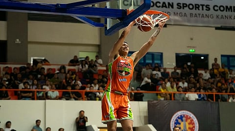 KYMANI Ladi delivers an emphatic slam during Caloocan’s 89-63 victory over Quezon City in the opening salvo of the SportsPlus MPBL 2026 Season at the Caloocan Sports Complex on Friday.