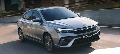 THE MG5 Prestige shows its updated front design with LED headlights and a wider stance on the road.