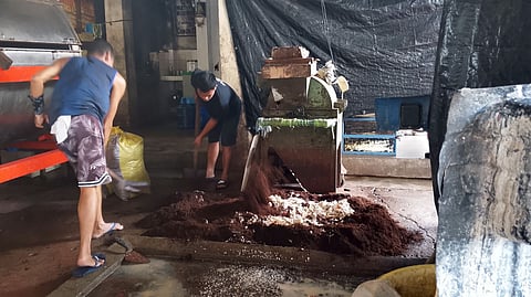 WORKERS compost kitchen and garden waste in Las Piñas City.