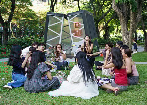 BOOK lovers gather at Ayala Triangle Gardens, sharing stories and laughter during Día del Libro.