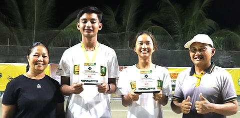 KATLYN Bugna (second from right) and Matthew Morris (second from left) hold their trophies alongside Verde Aces tennis courts owners Jing Alipo-on and Don Alipo-on after winning the Verde Aces Juniors Age Group Tennis Championships in Bacolod City.
