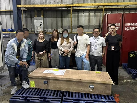 RELATIVES stand over the casket of Lucille Jean Gershovich, one more return in a line of Filipinos claimed by conflicts far from home.