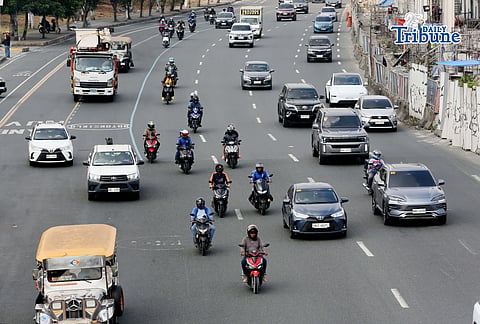 Motorists drive along Commonwealth Avenue in Quezon City on 17 April 2026. The Metropolitan Manila Development Authority observed a slight reduction in traffic on major roads as drivers adjust to rising fuel prices.
