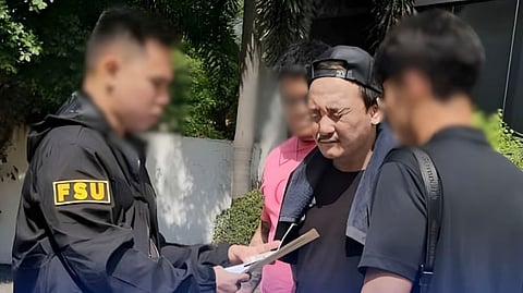 BUREAU of Immigration agents, in coordination with South Korean authorities and Interpol, arrest Lee Jonghak (center) at a residential subdivision in Las Piñas City. Lee is wanted for his alleged role as an assistant manager in a transnational syndicate that operated 23 illegal online gambling websites, reportedly generating more than 350 billion won in earnings.