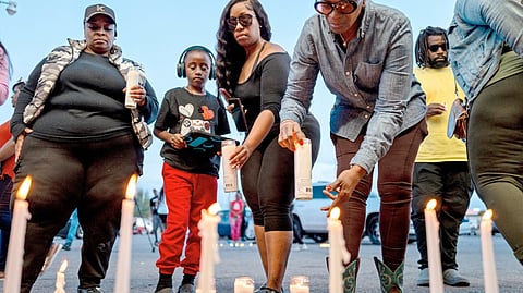 PEOPLE attend a candlelight vigil on 19 April 2026 in Shreveport, Louisiana.