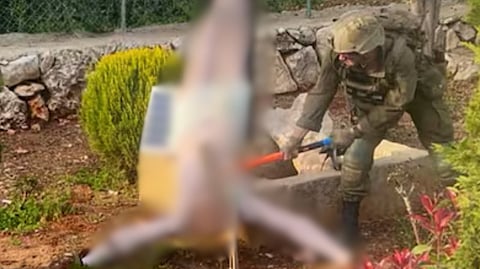 Israeli soldier hammers Jesus Christ statue