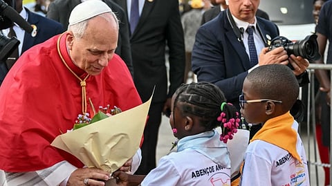 POPE Leo XIV receives a bouquet from children upon his arrival to meet bishops at the Parish of Our Lady of Fatima on 20 April, the eighth day of his 11-day apostolic journey to Africa.