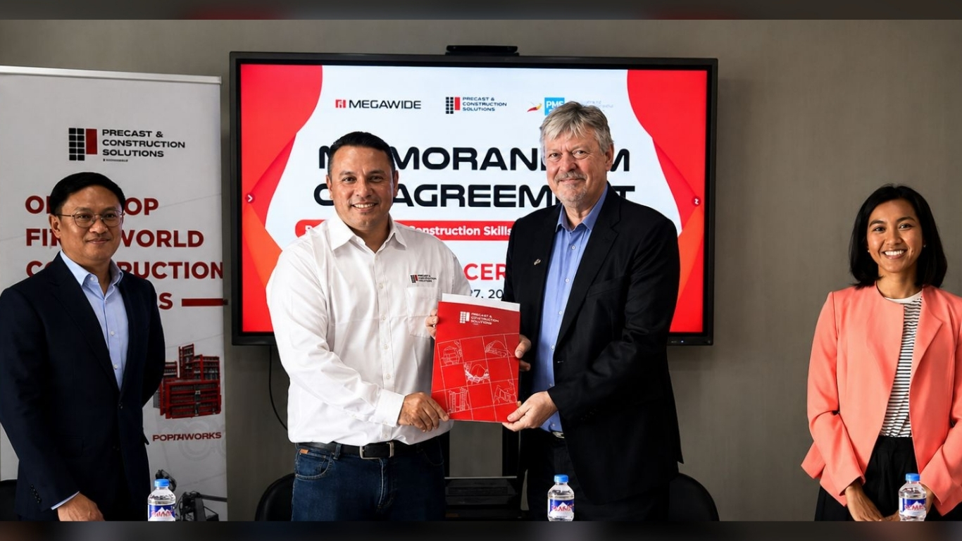 MARKUS Hennig (second from left), executive vice president of Megawide Construction Corporation, and Christopher Zimmer (second from right), executive director of German-Philippine Chamber of Commerce and Industry, present the signed agreement for a dual training program for precast concrete constructors during the launch event in Makati City.