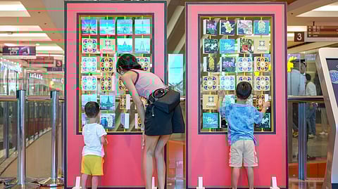 CHILDREN explore the interactive features.